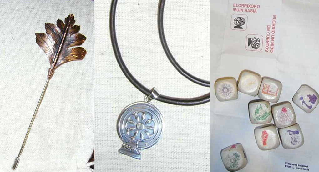 Un broche con la hoja de 'elorri', la estela de Argiñeta y un juego de mesa serán los recuerdos de Elorrio.